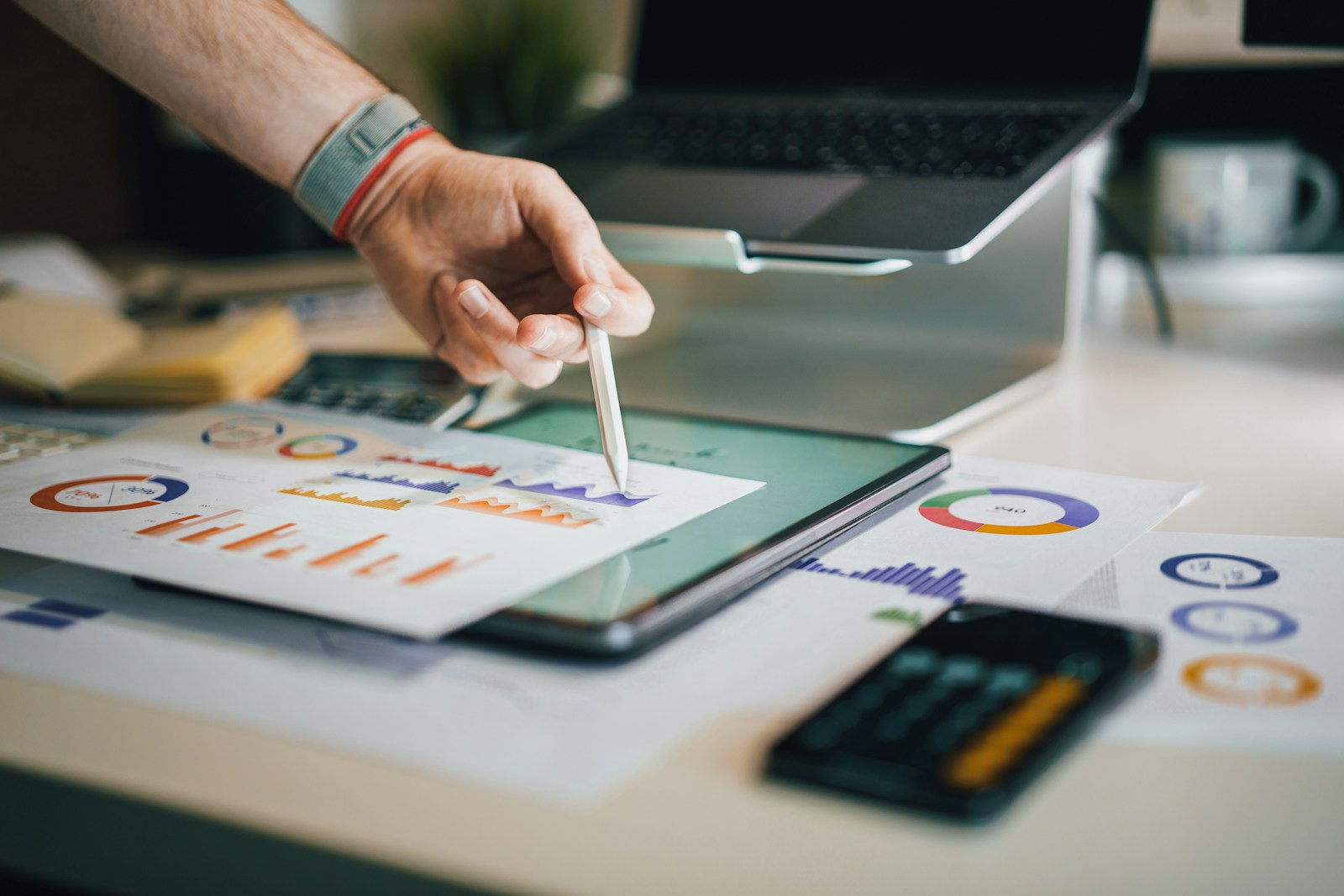 Professional reviewing analytical charts on a tablet