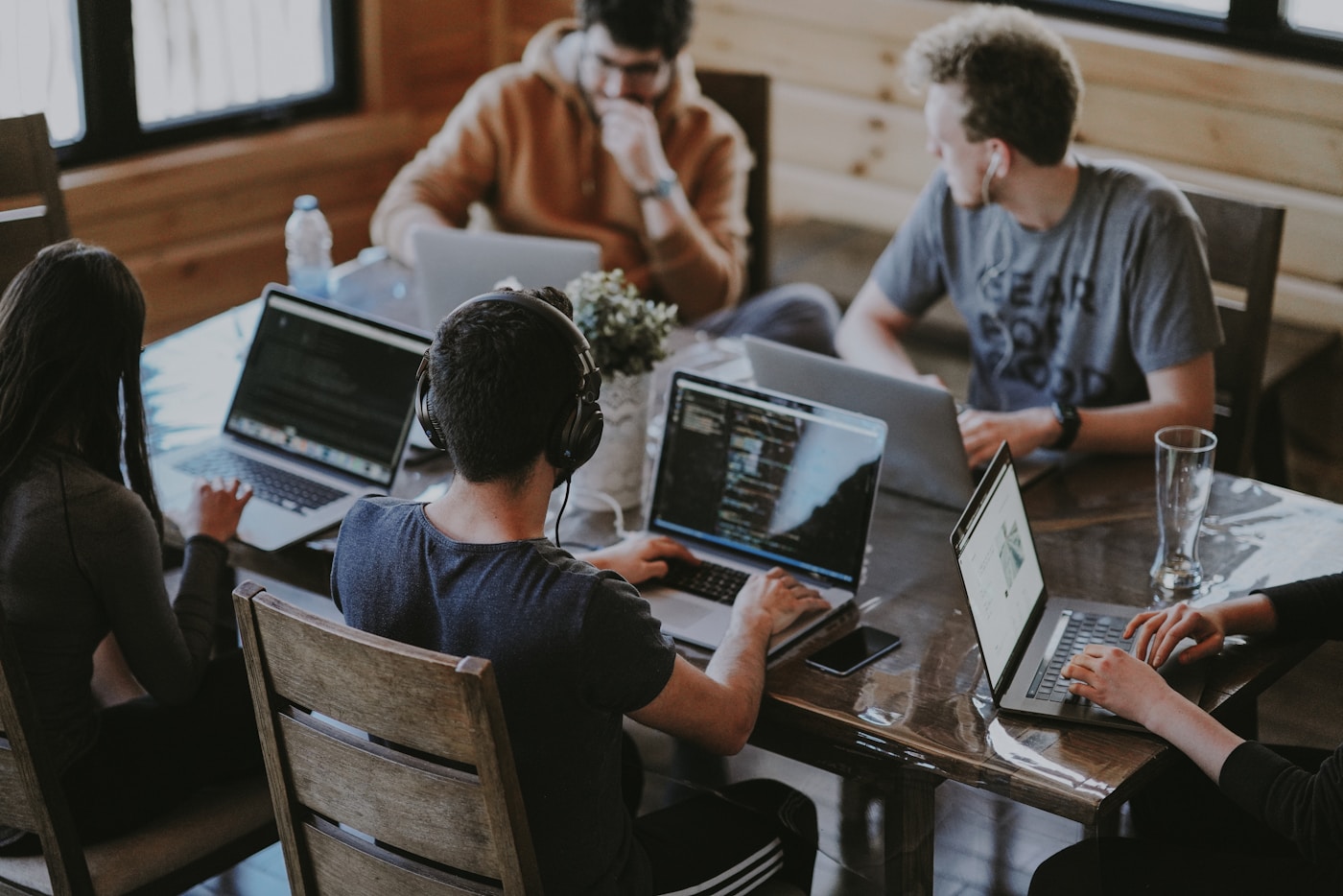 Professional team collaborating in front of a computer